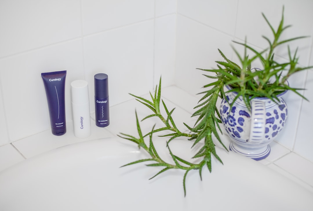 Bottles of dog shampoo and conditioner in a bathroom