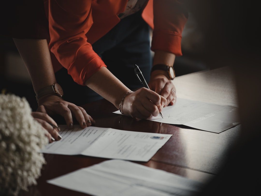 Close-up of a signed puppy purchase contract and pen on a table