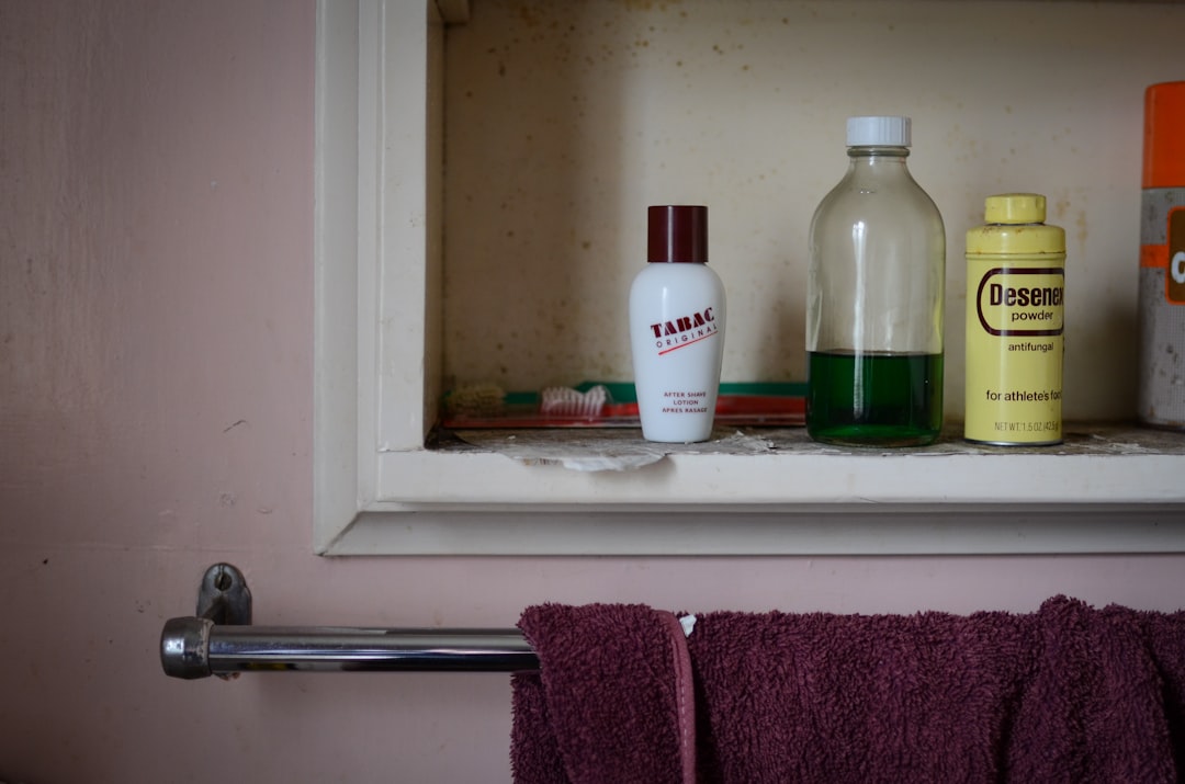 Bathroom windowsill with medications and toiletries within reach