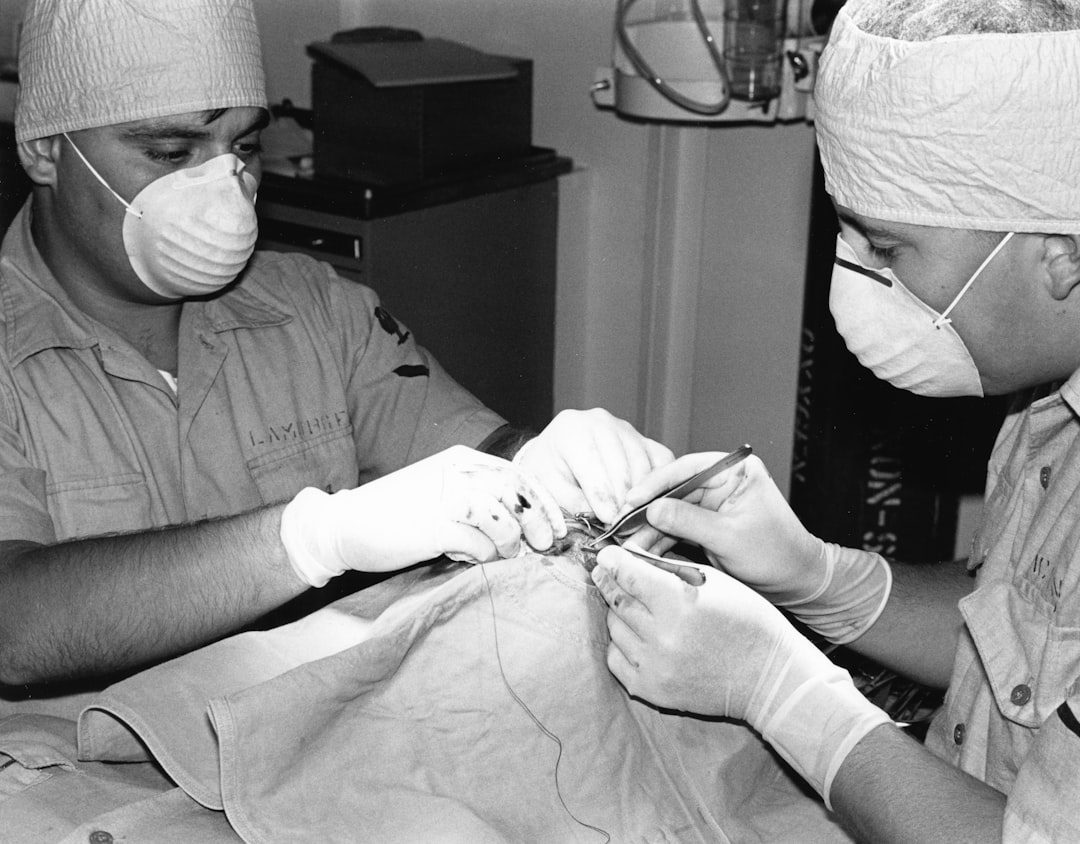 Veterinary staff performing a surgical procedure in an operating room